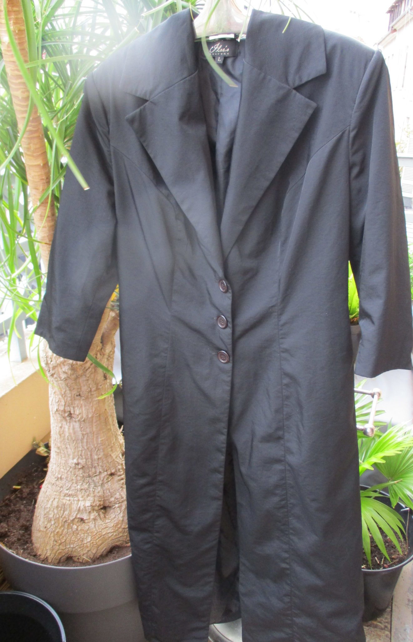 Black tailored coat by Danish designer Ilse Jacobsen