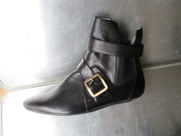 Low black leather ankle boots with buckles and pointed front