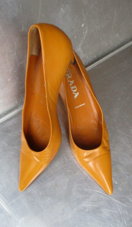 Prada orange leather pumps